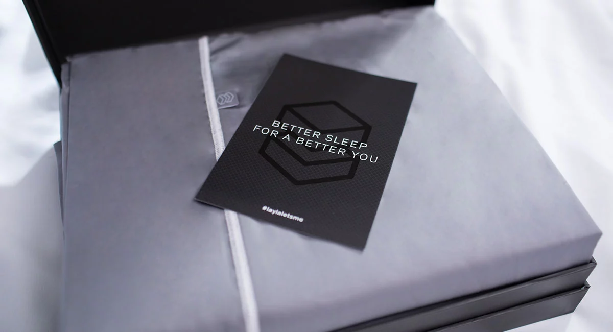 Gray sheet unboxing with a note that says better sleep for a better you