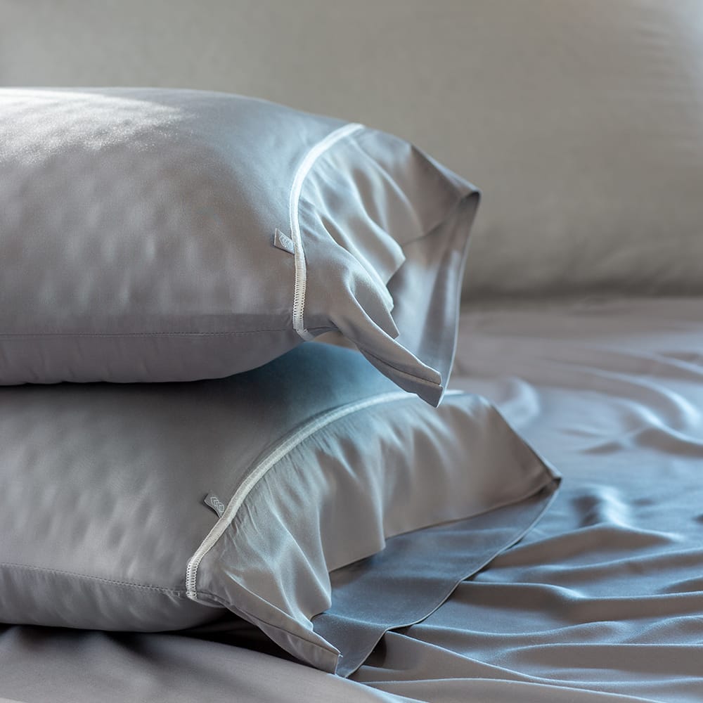 Gray layla bamboo sheet & layla pillow with gray color on the bed.