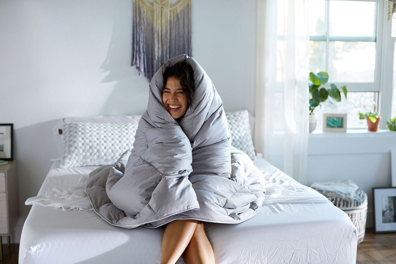 Woman laying on bamboo sheets