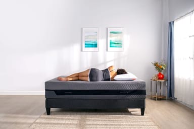 Woman laying down on hybrid mattress