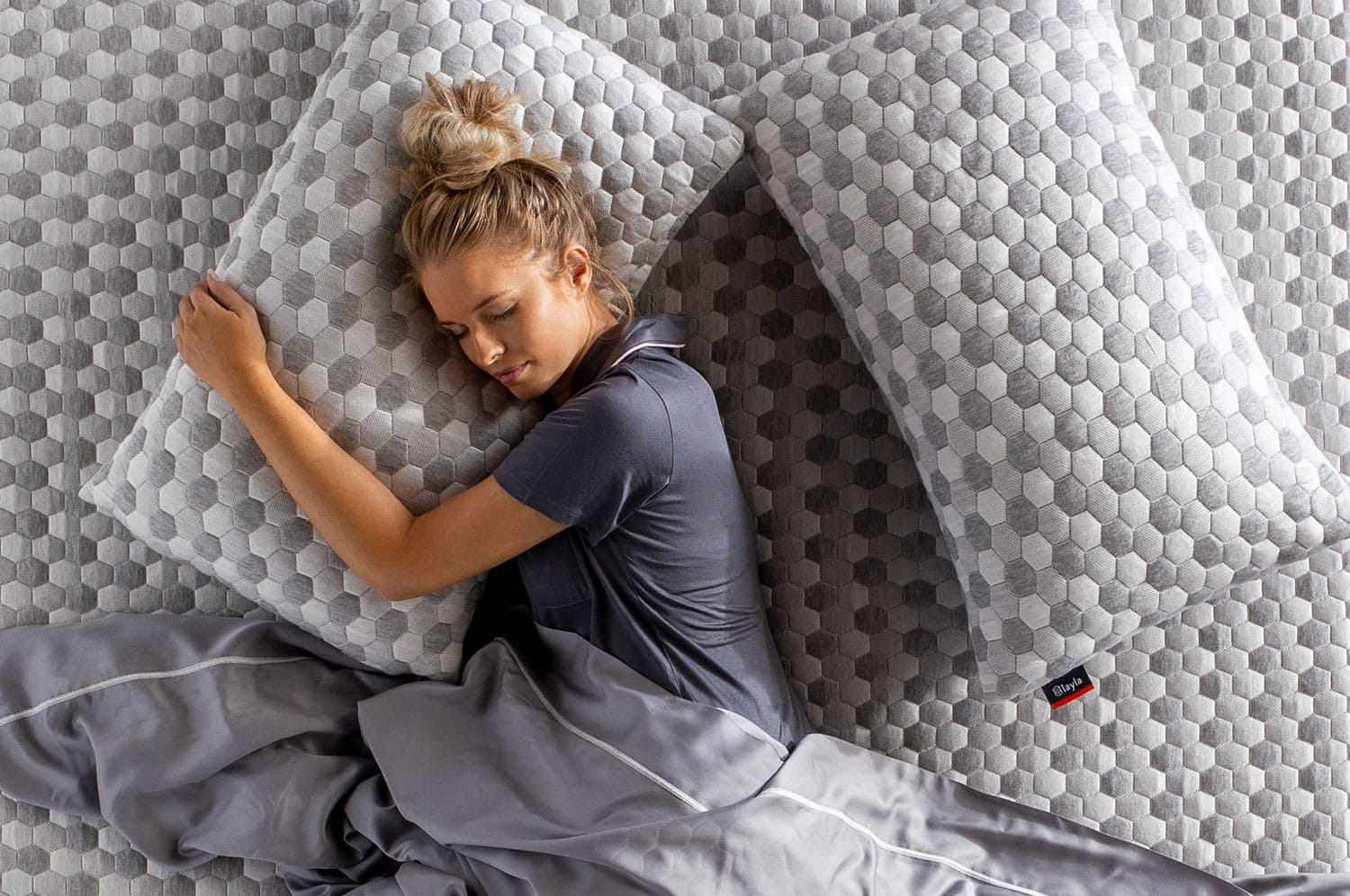 Woman laying on kapok pillow