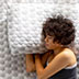 Woman laying on mattress